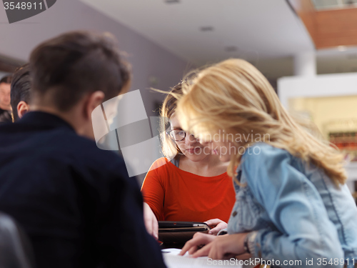 Image of students group working on school  project  together