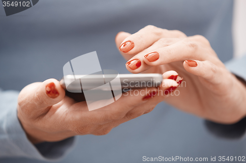 Image of Woman using smartphone