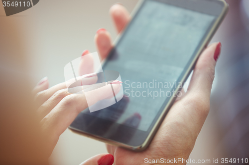 Image of Woman using smartphone