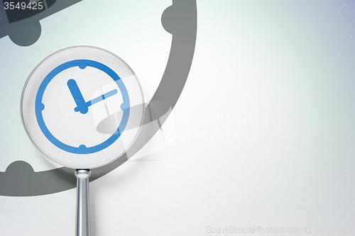 Image of Timeline concept:  Clock with optical glass on digital background
