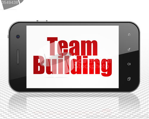 Image of Finance concept: Smartphone with Team Building on display