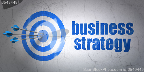 Image of Finance concept: target and Business Strategy on wall background