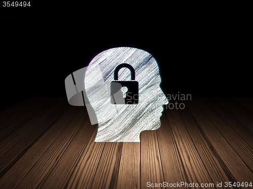 Image of Data concept: Head With Padlock in grunge dark room