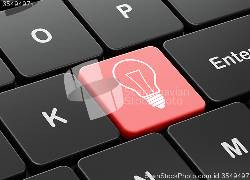 Image of Business concept: Light Bulb on computer keyboard background