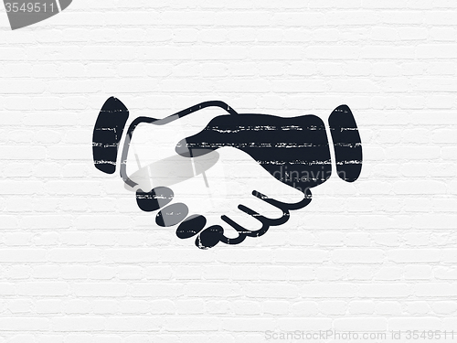 Image of Business concept: Handshake on wall background