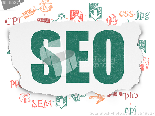 Image of Web development concept: SEO on Torn Paper background