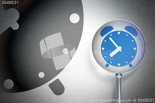 Image of Time concept:  Alarm Clock with optical glass on digital background