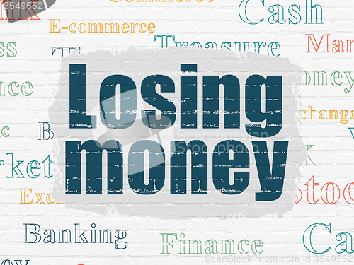 Image of Money concept: Losing Money on wall background