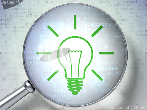 Image of Finance concept: Light Bulb with optical glass on digital background