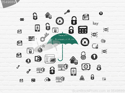 Image of Security concept: Umbrella on wall background