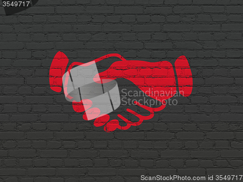 Image of Finance concept: Handshake on wall background