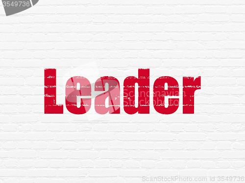 Image of Business concept: Leader on wall background