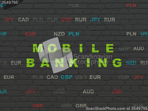 Image of Currency concept: Mobile Banking on wall background