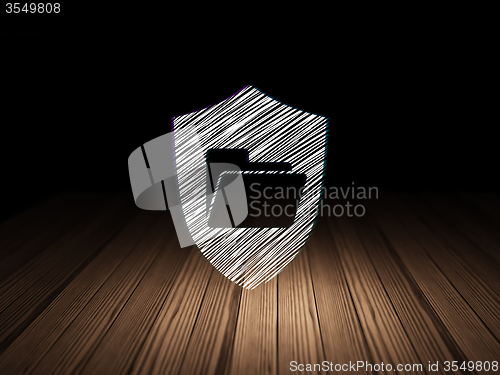 Image of Business concept: Folder With Shield in grunge dark room