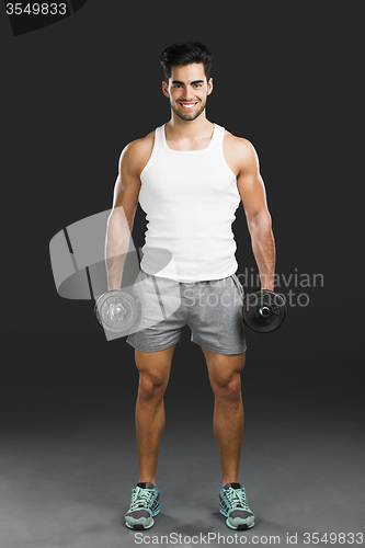 Image of Athletic man lifting weights