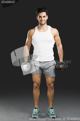 Image of Athletic man lifting weights