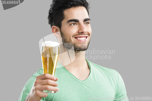 Image of Young man drinking beer