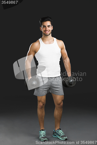 Image of Athletic man lifting weights