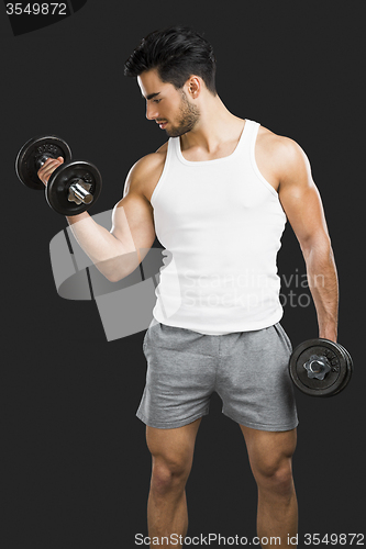 Image of Athletic man lifting weights