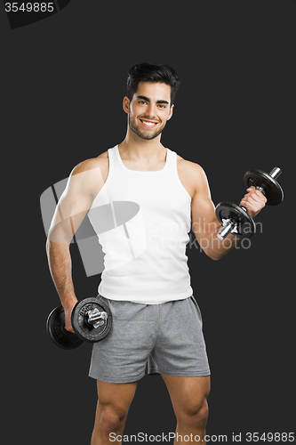 Image of Athletic man lifting weights