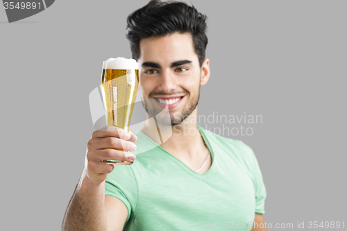 Image of Young man drinking beer