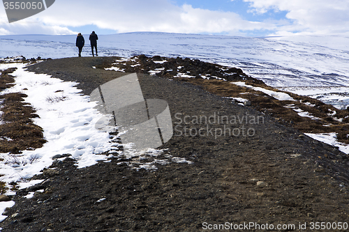 Image of Tourists at the Icelandic waterfall Godafoss in wintertime