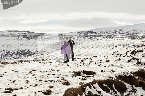 Image of Hikers in wintry mountain landscape