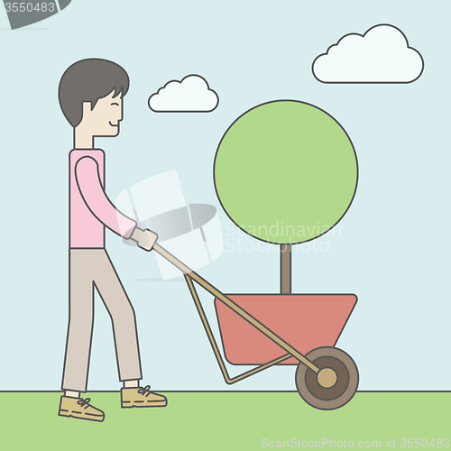 Image of Man pushing cart.