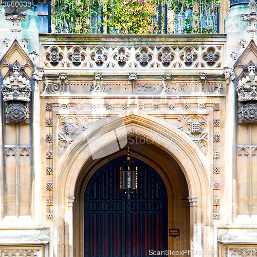 Image of parliament in london old church door and marble antique  wall