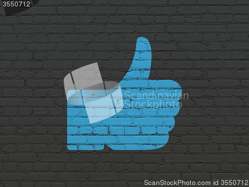 Image of Social media concept: Thumb Up on wall background