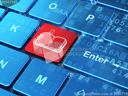 Image of Science concept: Book on computer keyboard background