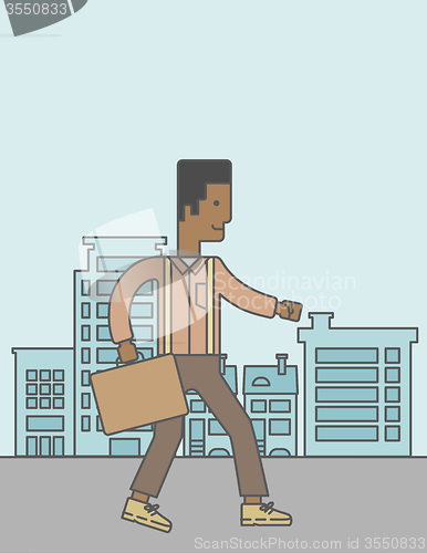 Image of Businessman walking with briefcase. 