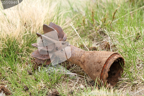 Image of bomb shell case left in the field