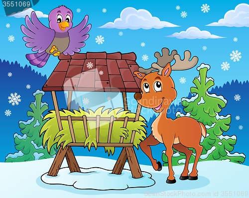 Image of Hay rack with reindeer and bird