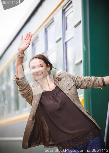 Image of beautiful middle-aged woman returned from a trip