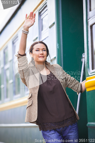 Image of beautiful middle-aged woman returned from a retro travel