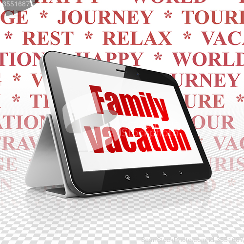 Image of Tourism concept: Tablet Computer with Family Vacation on display