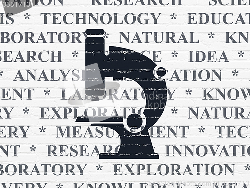 Image of Science concept: Microscope on wall background