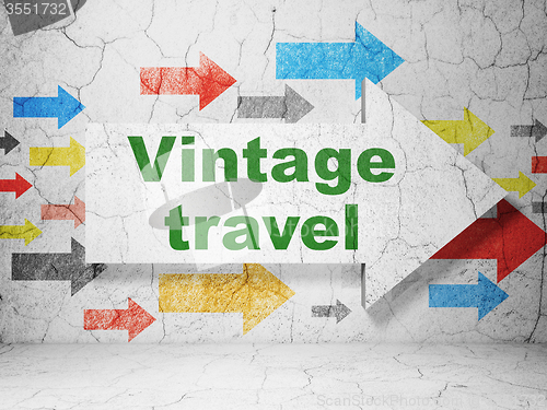 Image of Tourism concept: arrow with Vintage Travel on grunge wall background