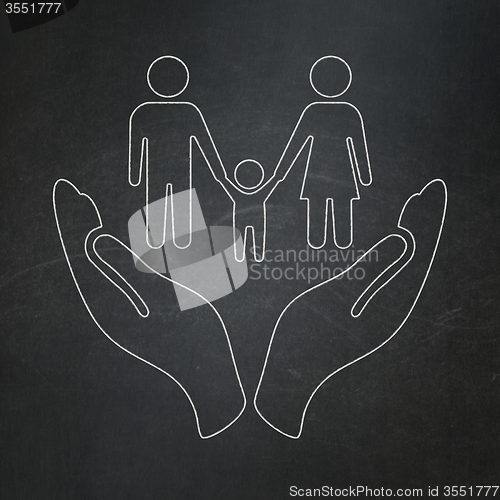 Image of Insurance concept: Family And Palm on chalkboard background