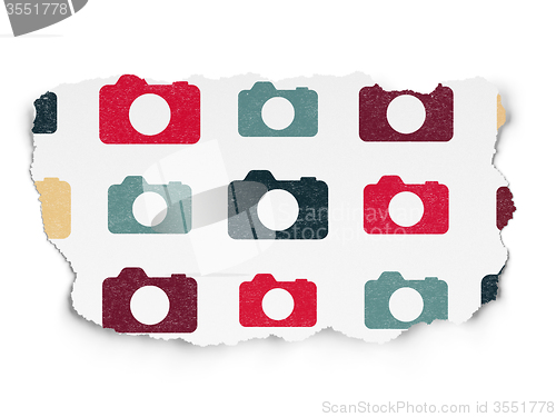 Image of Tourism concept: Photo Camera icons on Torn Paper background