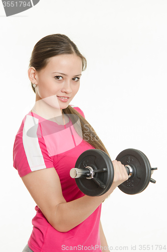 Image of Beautiful athlete dumbbell in right hand