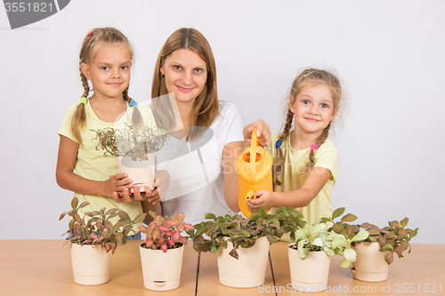 Image of Mom and daughter Fitton watered from a watering can