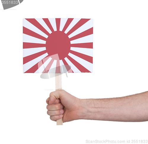 Image of Hand holding small card - Flag of Japan