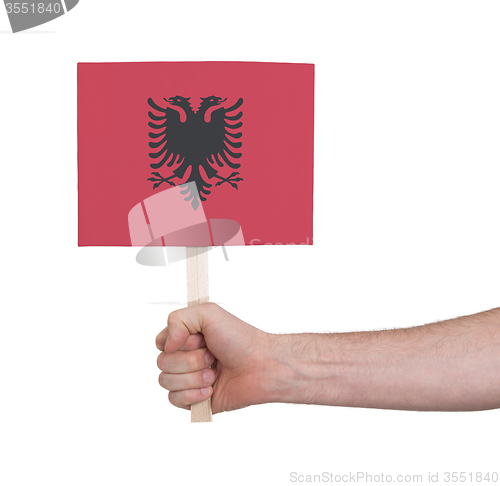 Image of Hand holding small card - Flag of Albania