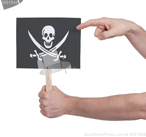 Image of Hand holding small card - Flag of Pirate