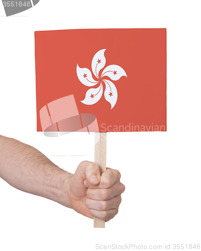 Image of Hand holding small card - Flag of Hong Kong