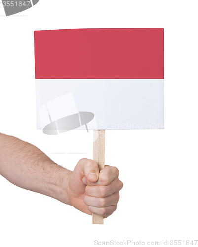 Image of Hand holding small card - Flag of Indonesia