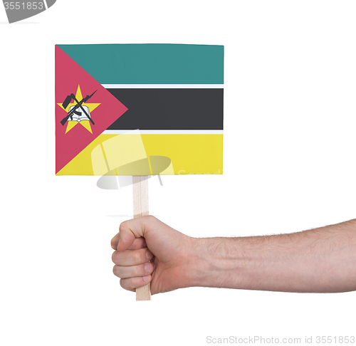 Image of Hand holding small card - Flag of Mozambique