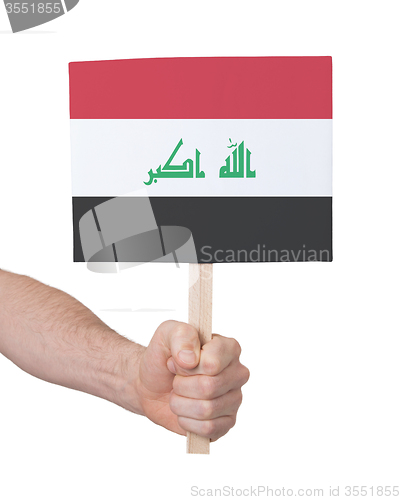 Image of Hand holding small card - Flag of Iraq